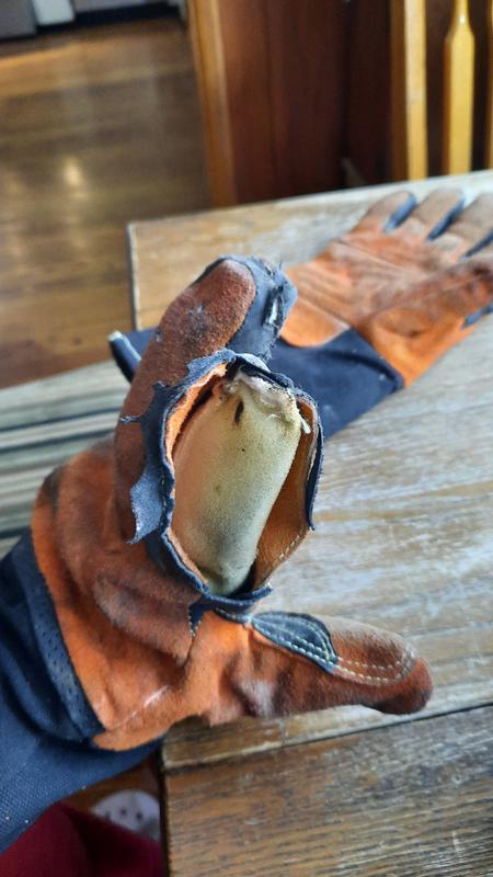 JOBSMART glove after less than one month of use loading a wood stove.