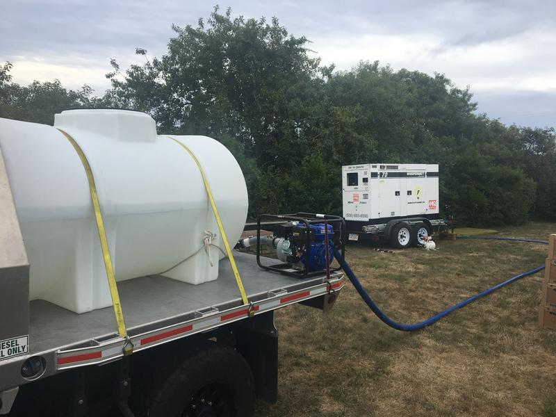 Tank on flat bed truck