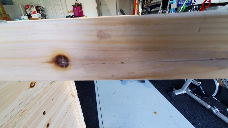 Puttied wood split, different lower leg