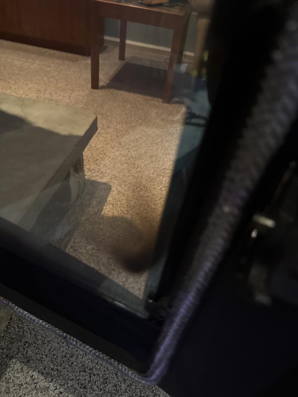 Soot left on glass, on a freshly cleaned stove