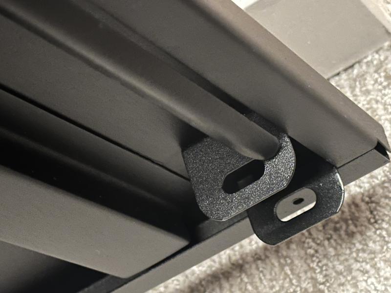 Locking operating rod coming out of guides.