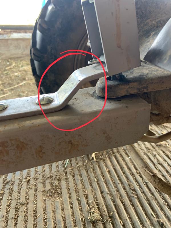 The circled bracket bends up when there is weight in the cart