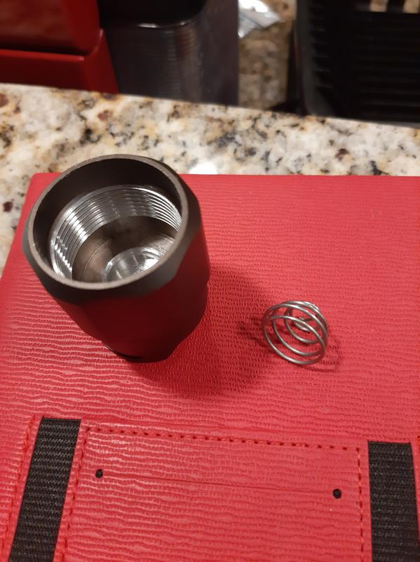 Larger spring came detached from cap of flashlight. I'm still unable to re attach.