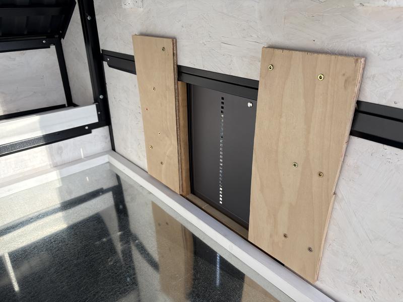 Inside coop, automatic door installed, coop floor in place