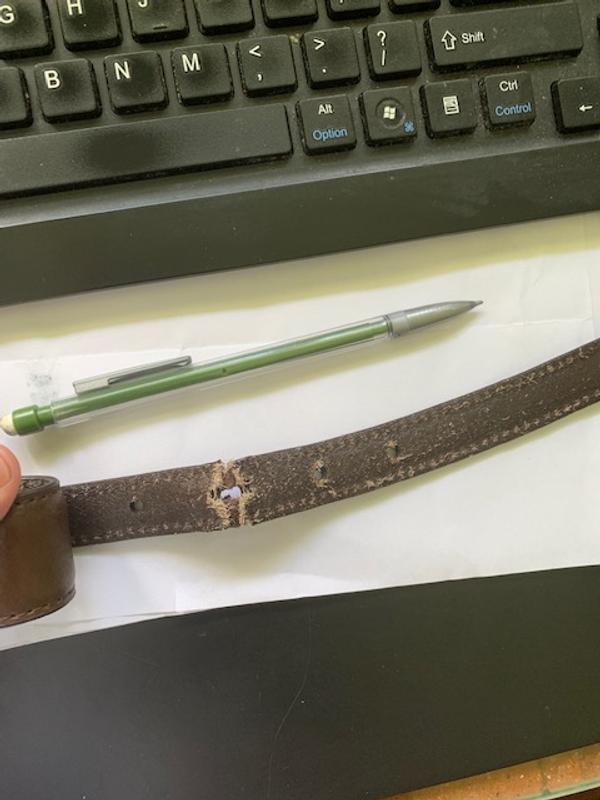 Inner side of belt "tongue" getting ready to tear off.
