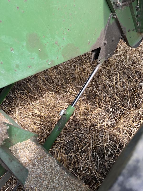Hose is connected to lower side underneath axle.