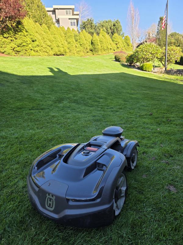 Steep slope, large yard and obstacles.