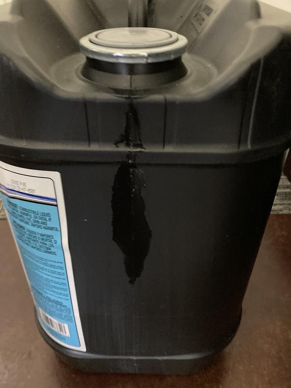 Leak at unopened cap; black, plastic jug