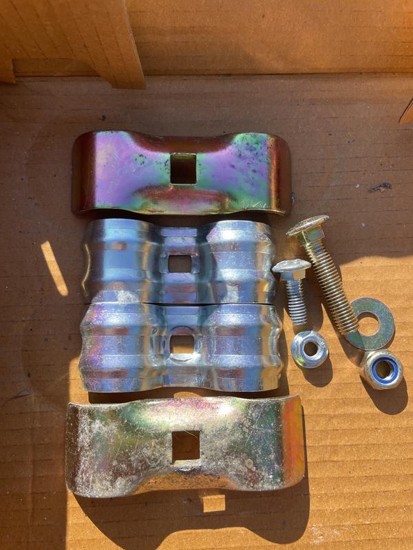 The photo shows the original (gold) against the replacement (silver) brackets and the length of corresponding bolts.