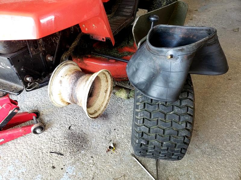 Could not remove the wheel. Used a torch with a puller as well. Had to do things the hard way while wheel was still on the tractor. (30 year old tractor. Simplicity makes great equipment!)