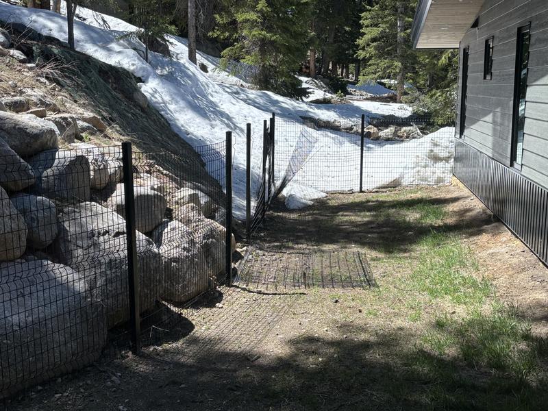 Snow destroyed fence panels