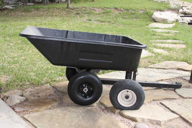 Garden Dump Trailer with new flat free tires mounted.  The old flat tire had a plastic rim and NO grease zerks.  The tires from Tractor Supply have steel rims, grease zerks, extra spacers and optional axle hubs 5/8" AND 3/4".