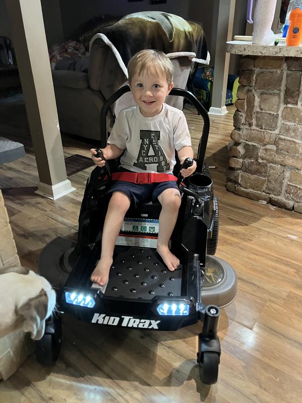 Enjoying his new riding mower like Daddy and G!