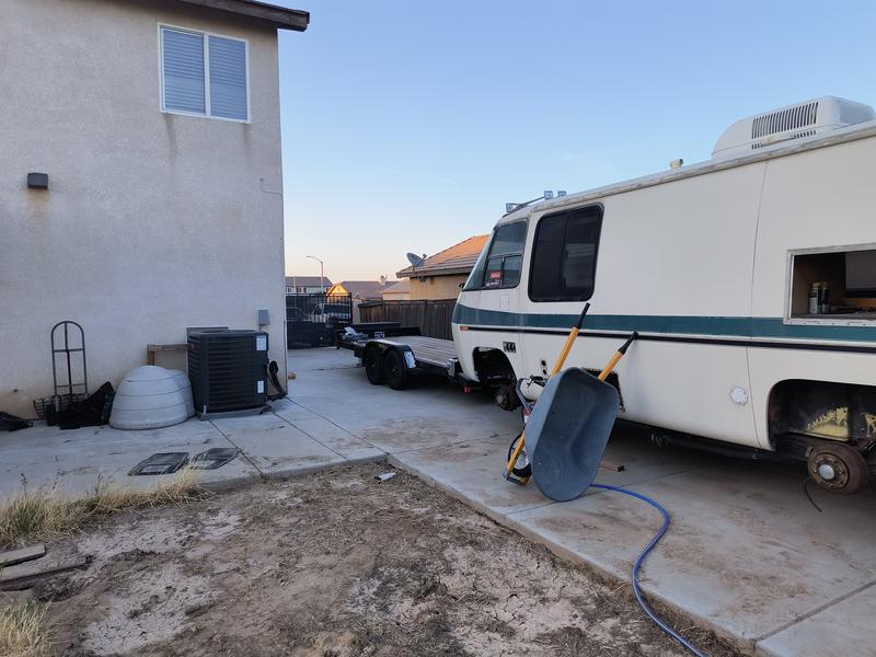 The hose reaches all the way across the rear storage area.