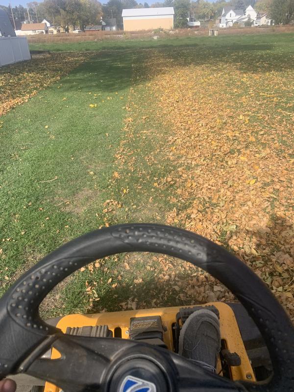 Changing hi lift to sandy soil blades and mowing leaves in windrows then mulching them in the ground