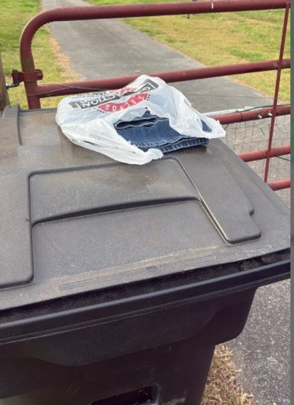Delivery left on trashcan that would be emptied within the hour.  Could have put the open bag over the gate or behind the trashcan.