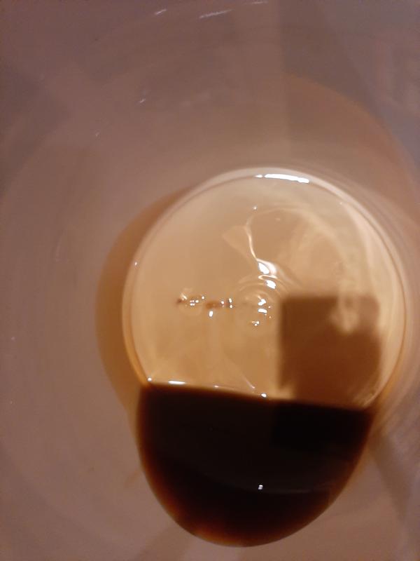 Plastic shavings in oil from gouges in bottom of bucket