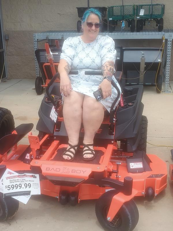 Right after purchase wife posing with mower.