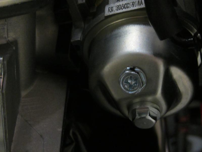 Phillips hex-head bolt drain plug.