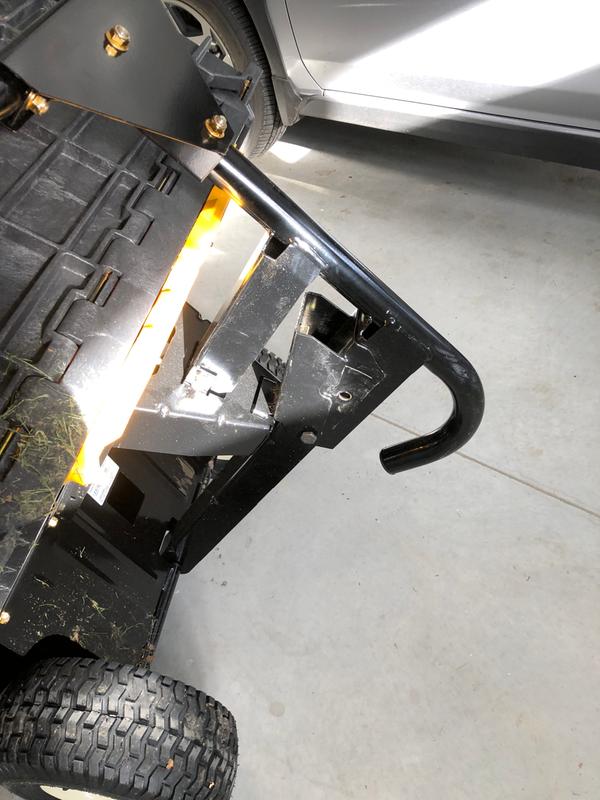 Two horizontal bars slot into cart’s frame.