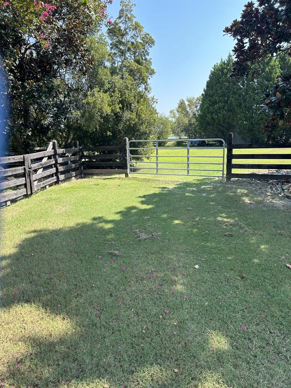 Nice & Straight unlike saggy wood gate on the Left