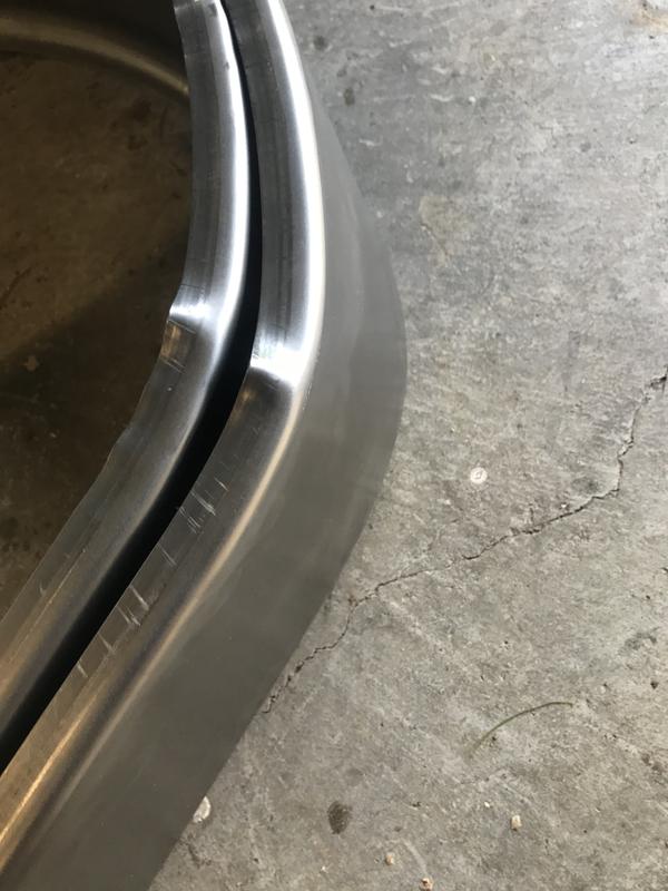 Ends bent in from rough handling