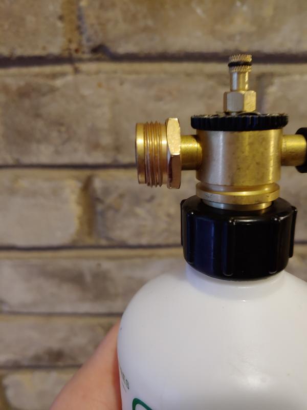 Bottle Removed, fastening nut up against junction between bottle and sprayer.