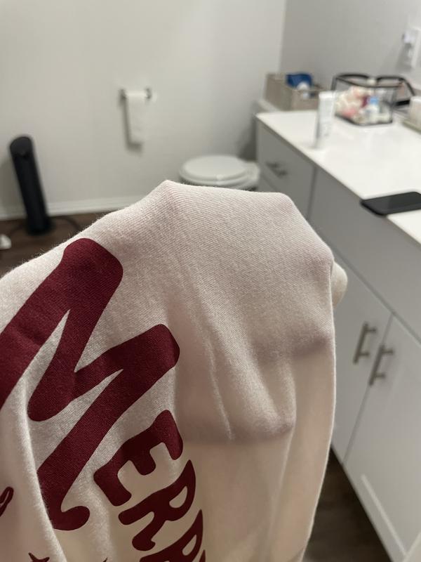 Demonstrating how thin the shirt is