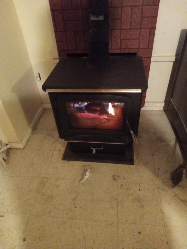 Break in burn. Built a 6" tall hearth for it to sit on. At 26" tall, it sits way to low.