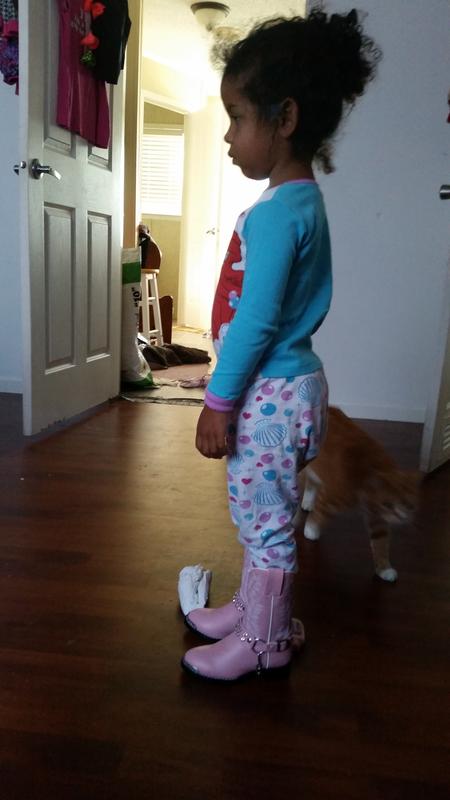 Cowgirl boots and Jammies! She won't take them off!!