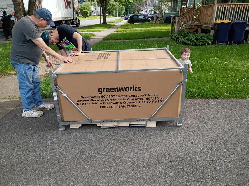 Arrived in a metal cage, cardboard box on a pallet