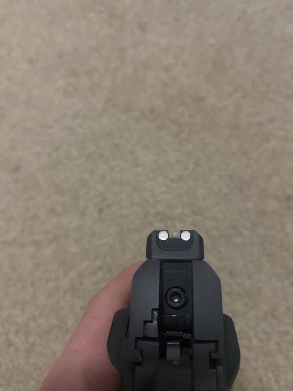 It is hard to show the looseness with just pictures. But the attachment is very loose for being compatible for the gun. The slide moves side to side and makes noise. The sights are good and I like the safeties.