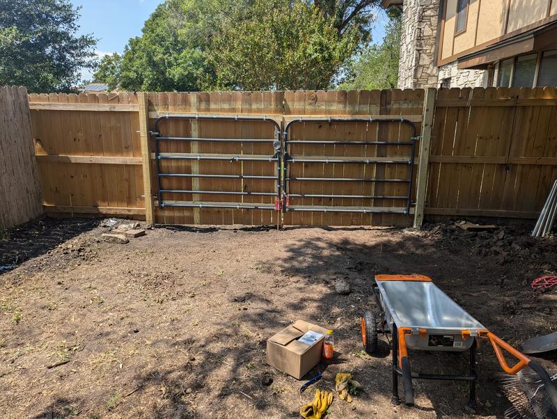 Tube gates with wood planks attached