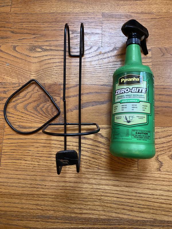 Holder broke and the contents of the fly spray leaked through a crack in the bottom from impact.
