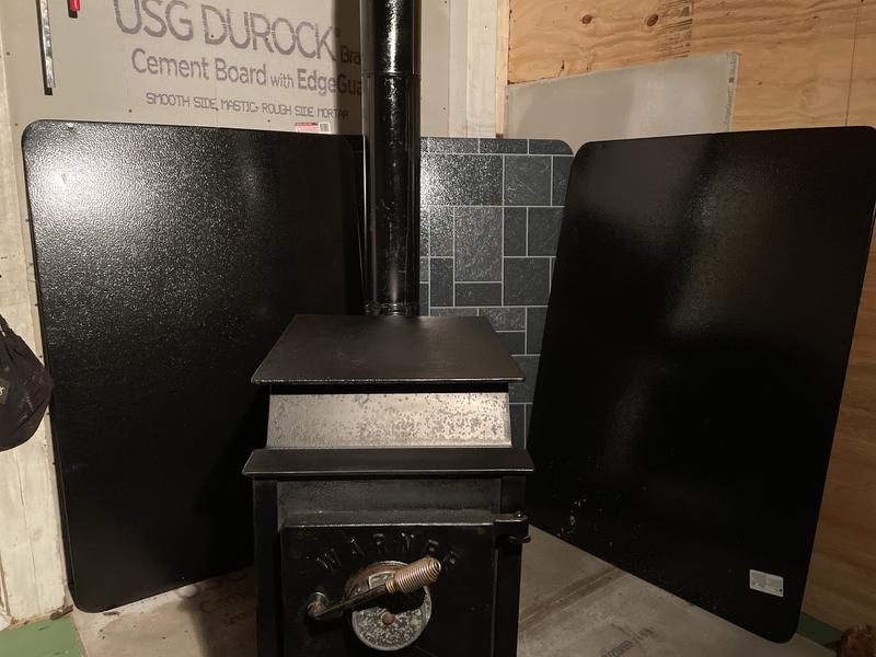 These three stove boards will
Work well once anchored in place behind my stove