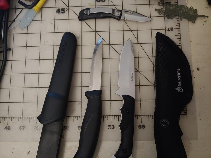 Morakniv and Gerber Freeman Guide side-by-side - with 25 year old Gerber EZ-Out Mini to show how well the finish holds up