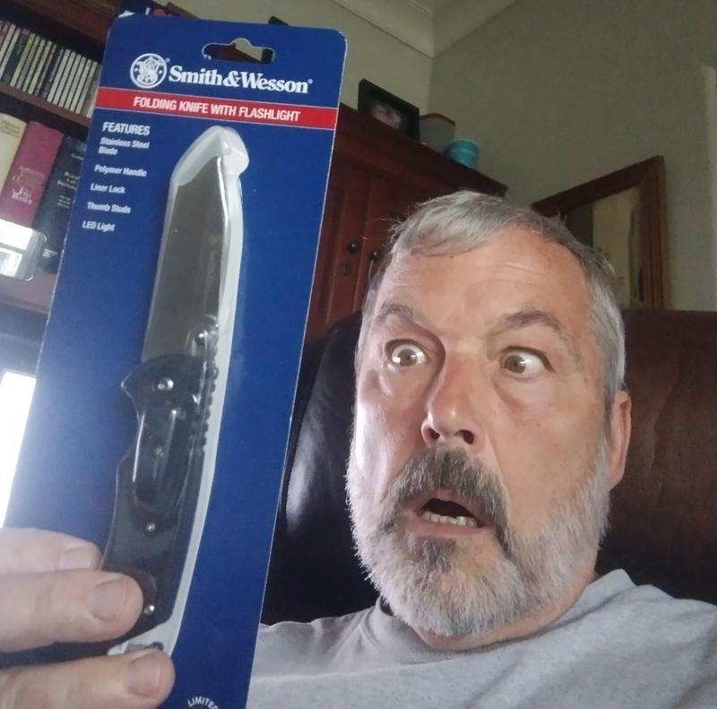 My friend reacts to my sending him the S&W knife as a surprise gift!
