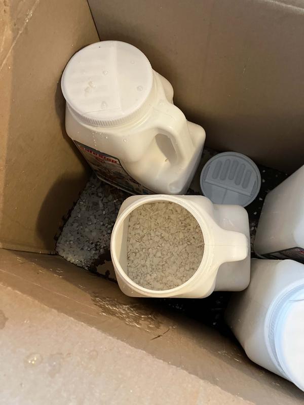 One container had cap off coating others and box with salt