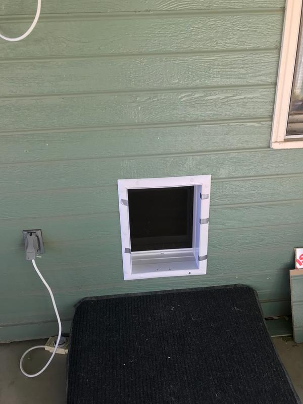 Electronic dog door -duct tape was temporary to help hold the seal of silicone we added