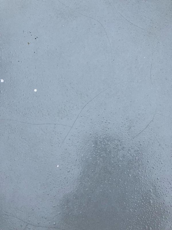 Finish cracked and blistered due to leaving the "outdoor" table outside