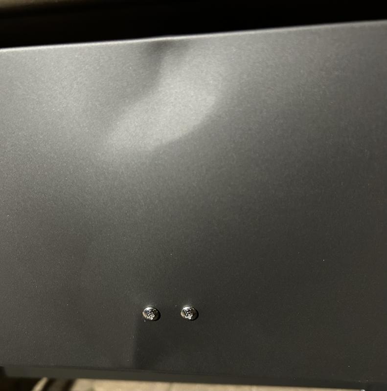 Dented back panel on the burner unit