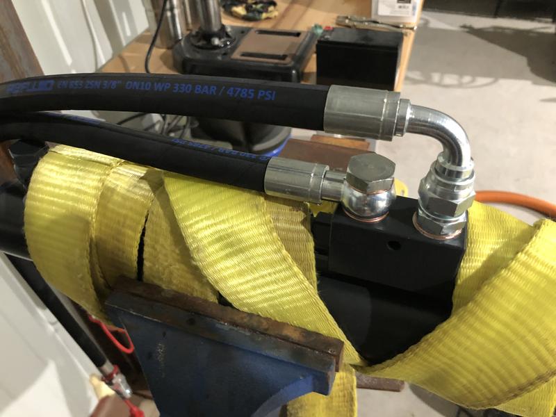 Wrapped in a strap and then put onto the vise- the lines need to be tight so that crush washer seals. Also wrap the threads with Teflon tape prior. I used about 3-4 wraps per line.