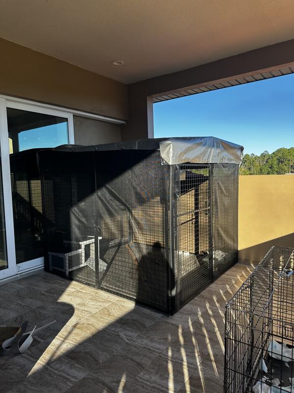 We wrapped cage with mosquito net and added a tarp to prevent any water from getting in.