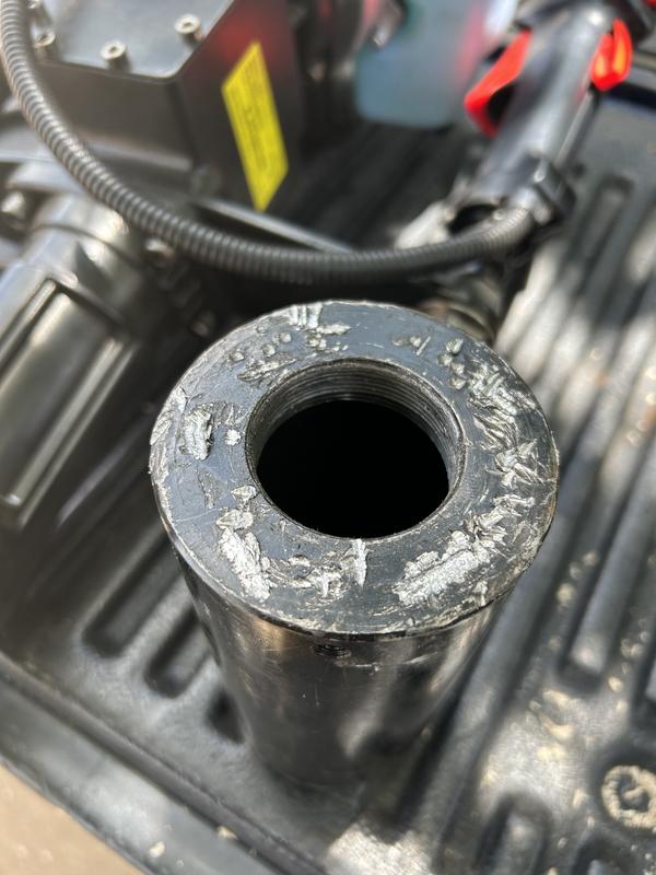 An hour of pounding with a hammer and prying with a homemade jig finally got the blasted puck off.