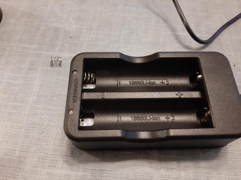 One spring came detached as you see in the picture of the charger