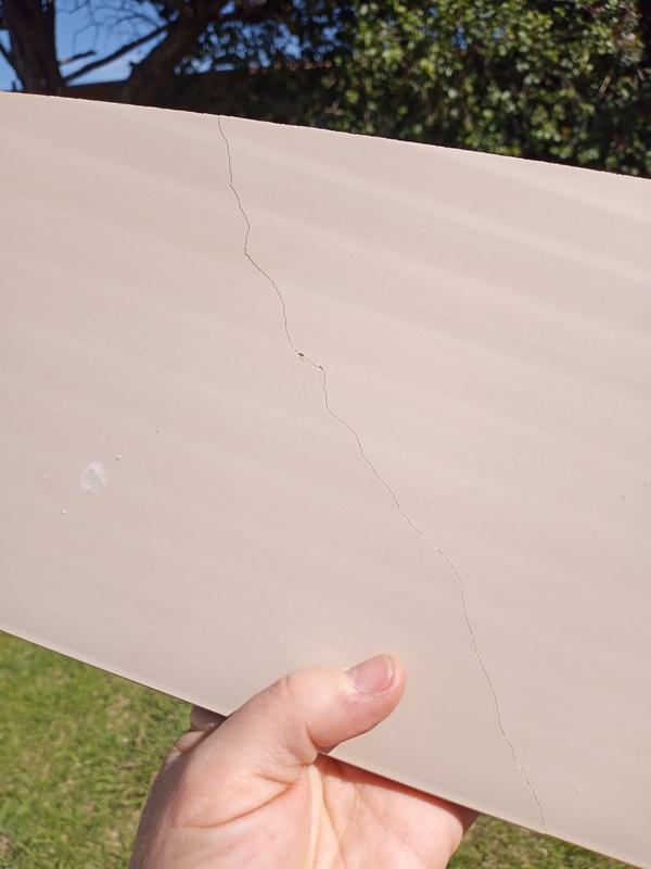 Tabs are broken and a board is cracked