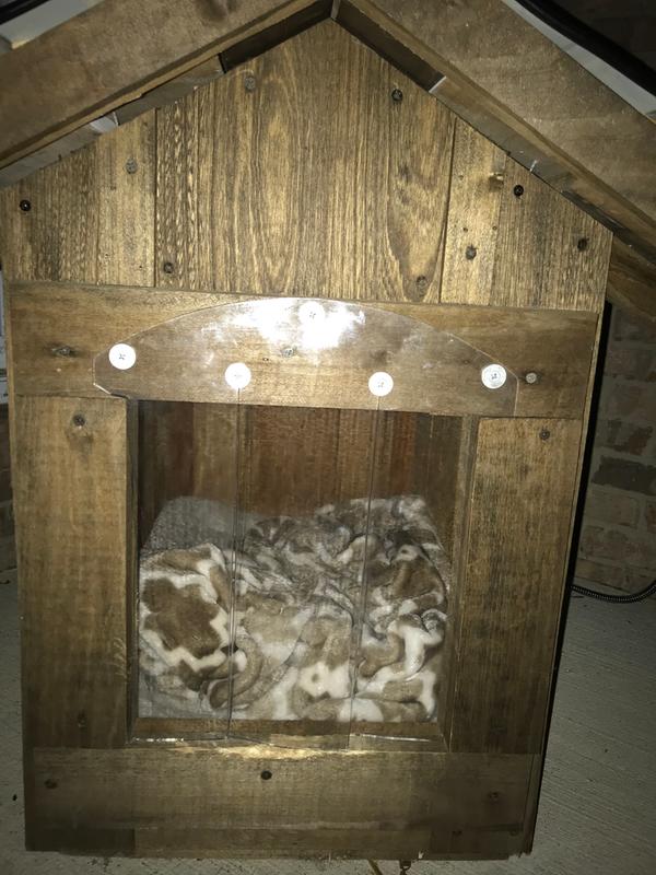 Reclaimed material dog house with the Trixie plastic door strips.