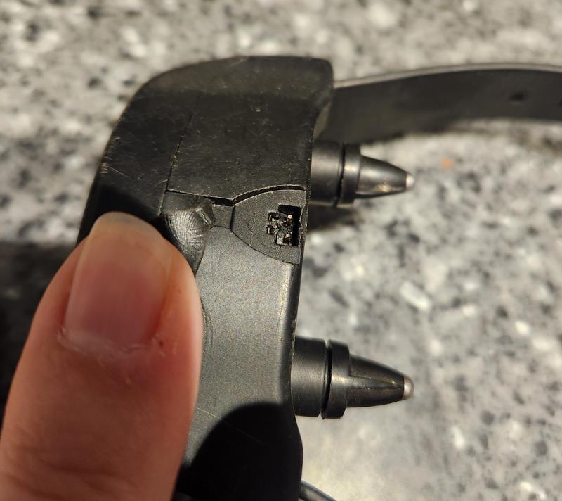 How the charger breaks off into the collar. They fixed this issue by having the snap on charger.