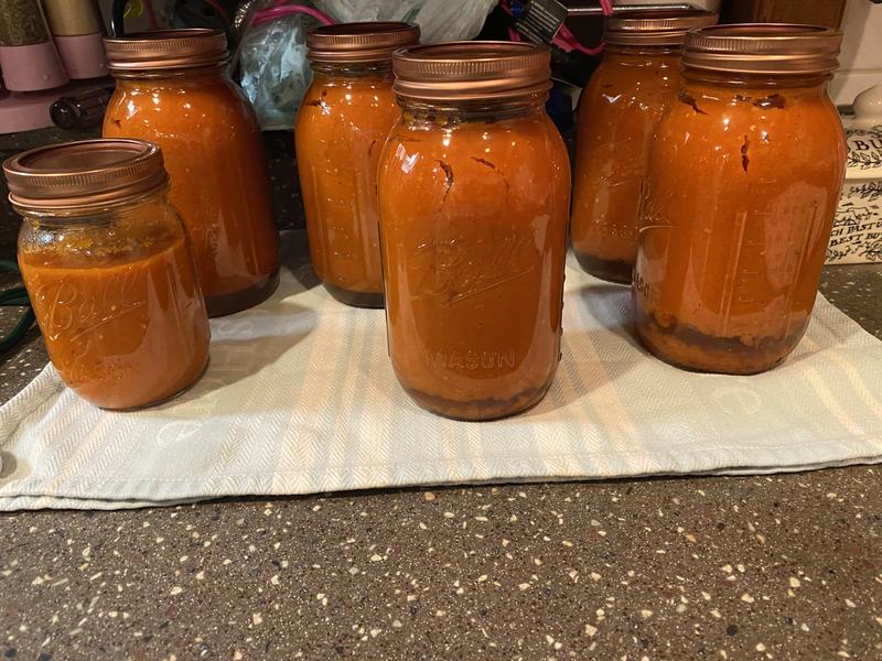 Homemade pasta sauce in quart jars.