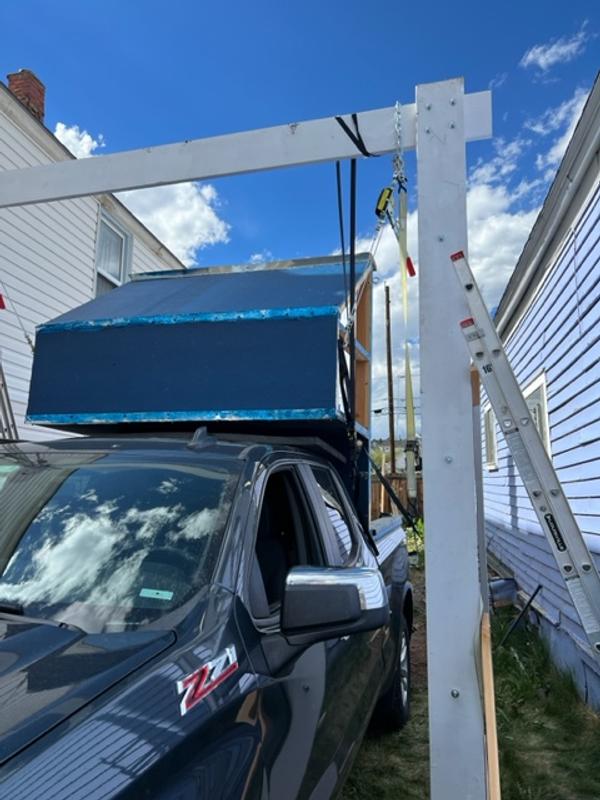 Forward component of truck camper in place via Reese Towpower 2 1/2 ton cable puller